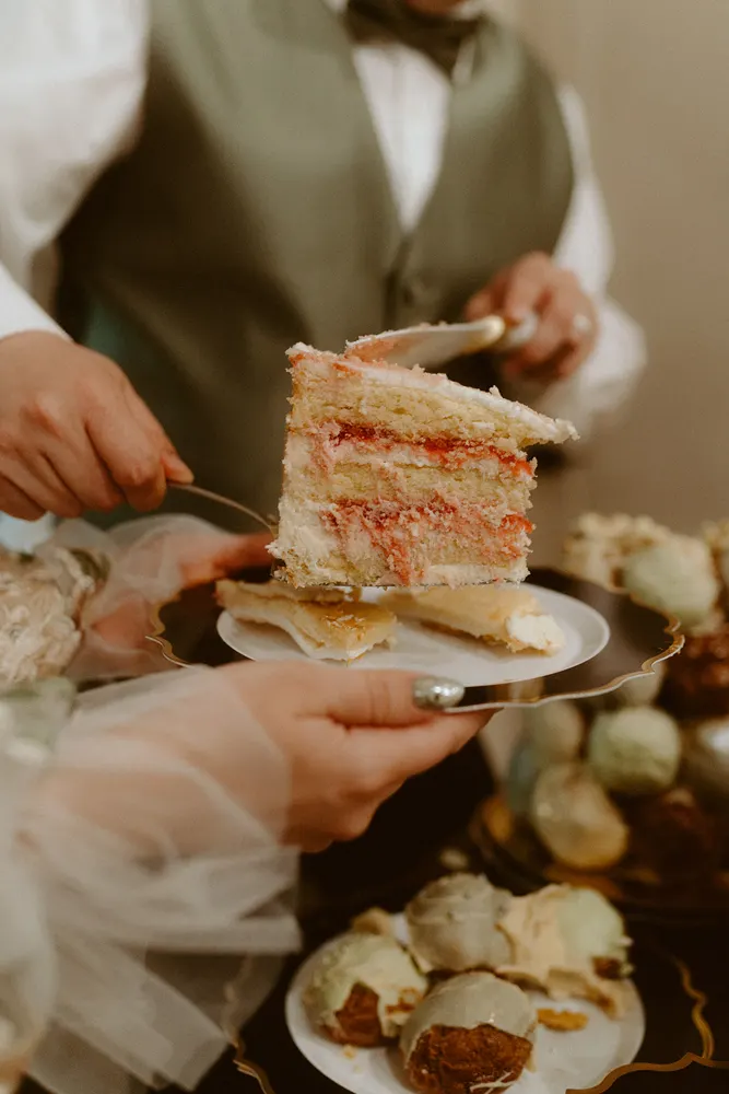 Serving a slice of wedding cake