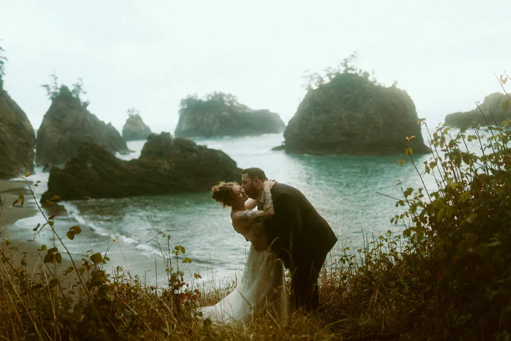 Logan beside Alli above the shore