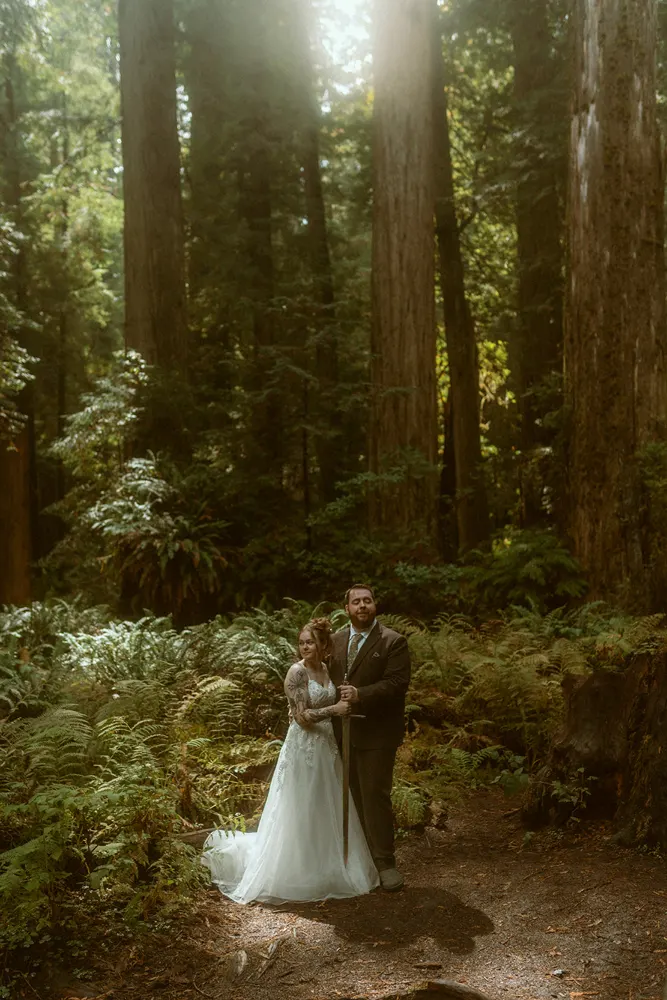 The couple surrounded by tall trees