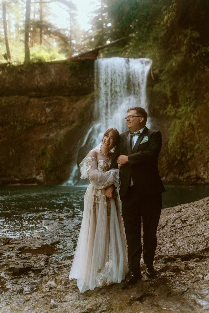 Portraits beside the rushing waterfall