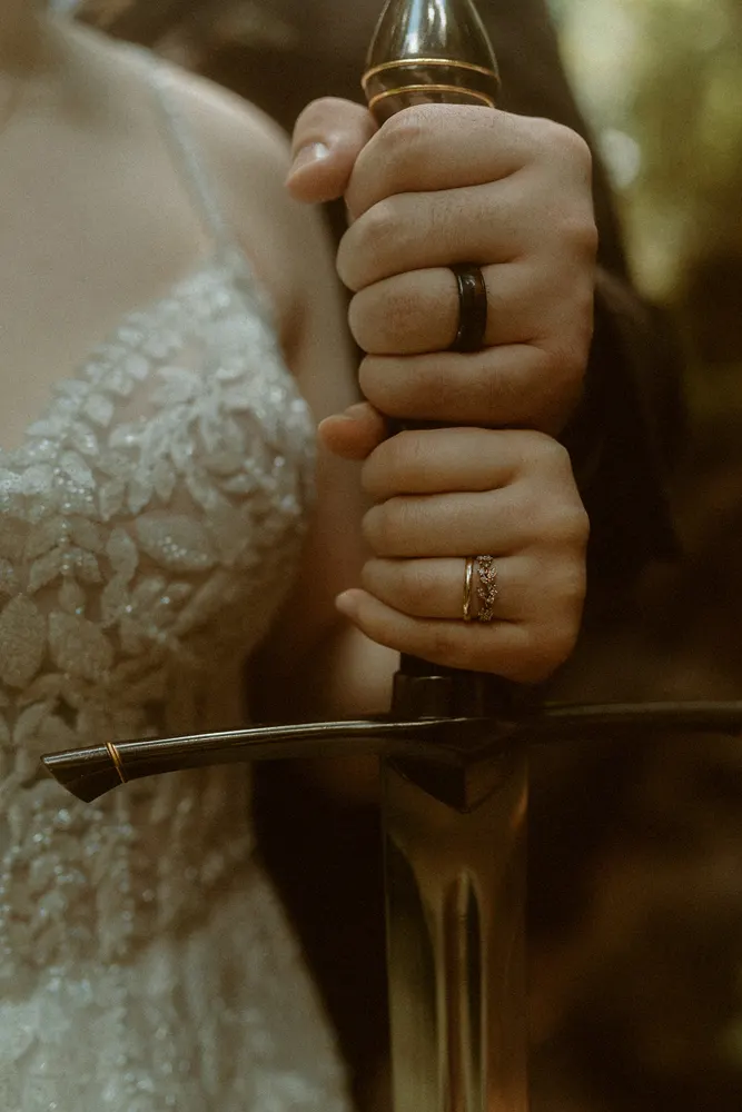Hands together around their sword