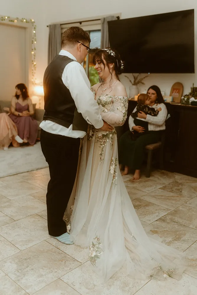 A first dance surrounded by their people