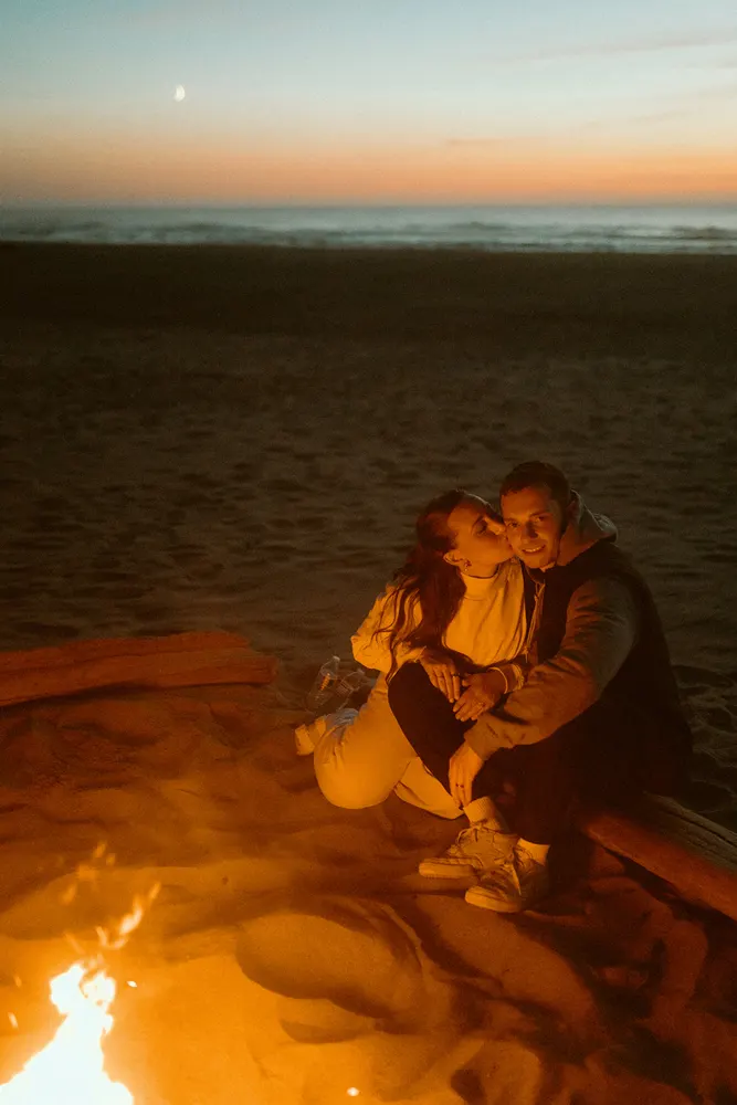 Comfy clothes and a kiss beside the bonfire