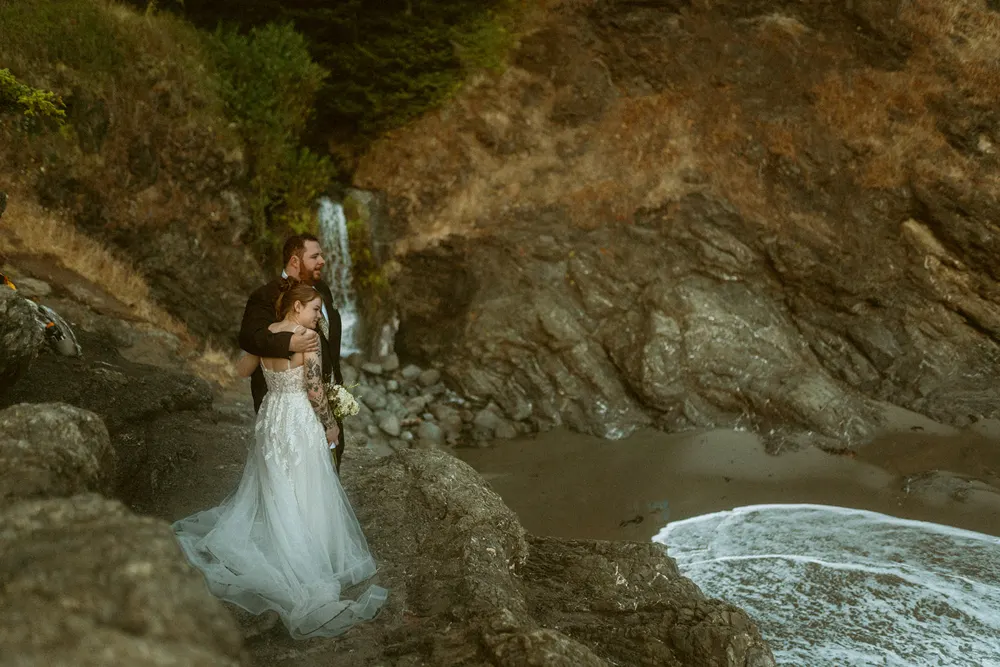 Alli beside the waves and cliffs