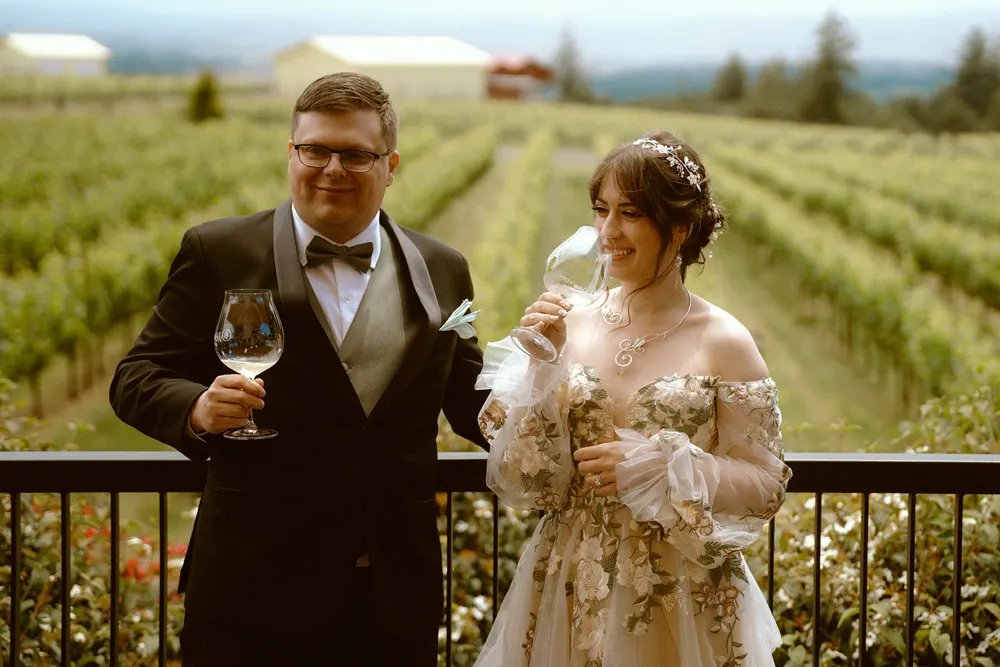 Celebrating with wine overlooking the vineyard